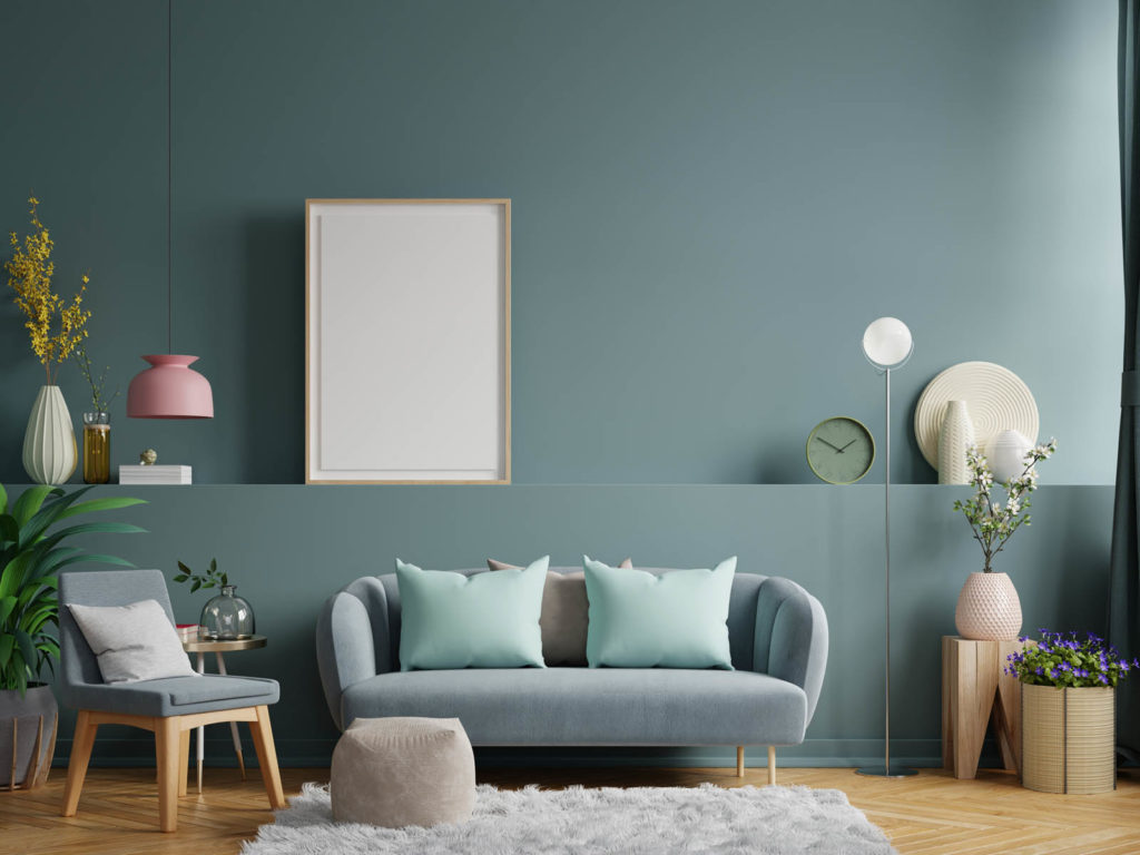 Living room interior wall mockup in bright tones with have sofa and lamp with dark green wall background.3d rendering